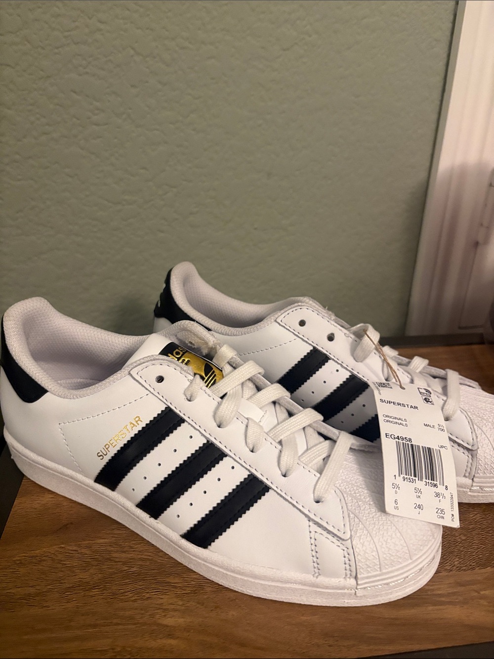 adidas White Sneakers with Black Three-Stripe Detailing